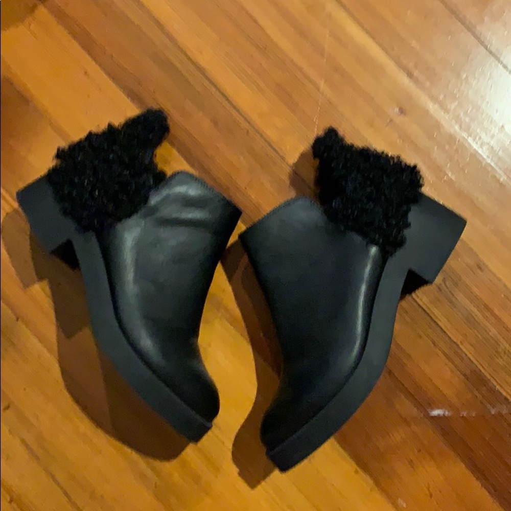 Black booties with fuzzy detail on heel